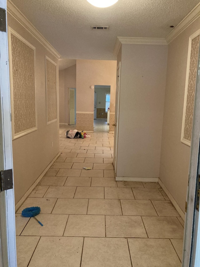 4627 Windstarr Dr, Destin, FL 32541 - hall featuring a textured ceiling, crown molding, and light tile patterned flooring