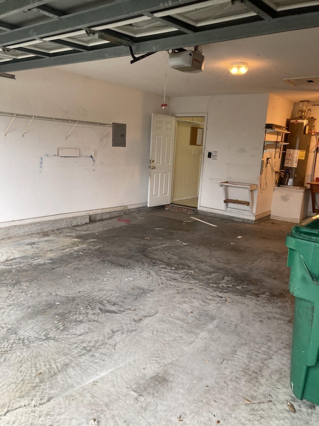 4627 Windstarr Dr, Destin, FL 32541 - garage with water heater, a garage door opener, and electric panel