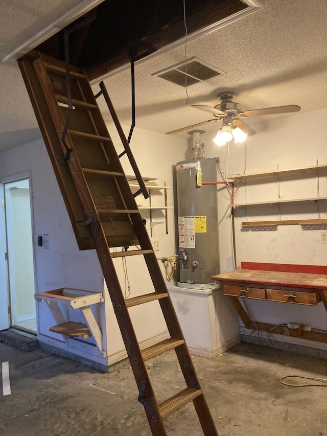 4627 Windstarr Dr, Destin, FL 32541 - basement with water heater, a textured ceiling, ceiling fan, and a workshop area