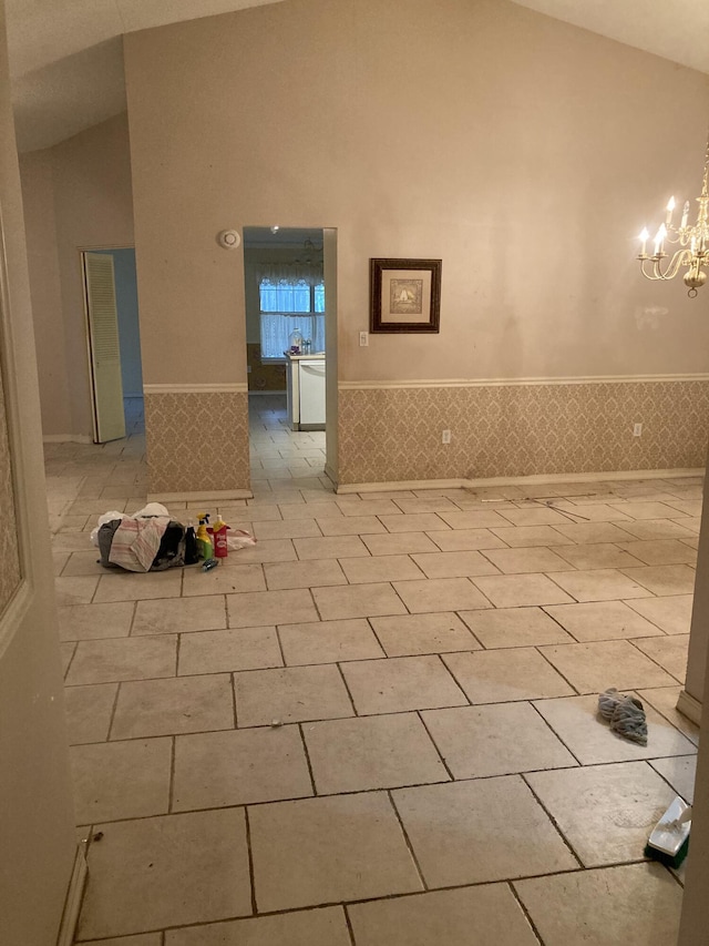 4627 Windstarr Dr, Destin, FL 32541 - corridor with high vaulted ceiling, wainscoting, and a chandelier