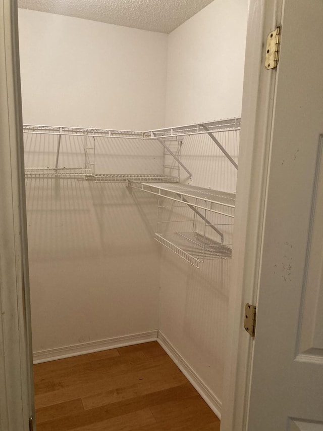 4627 Windstarr Dr, Destin, FL 32541 - spacious closet with wood finished floors