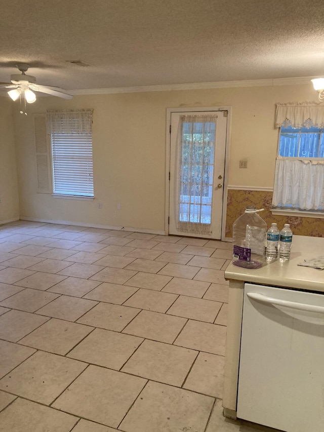 4627 Windstarr Dr, Destin, FL 32541 - interior space with crown molding, a textured ceiling, a ceiling fan, and light tile patterned flooring