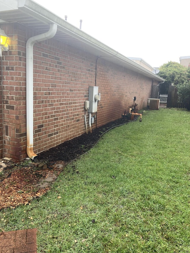 4627 Windstarr Dr, Destin, FL 32541 - view of side of home with a lawn and brick siding