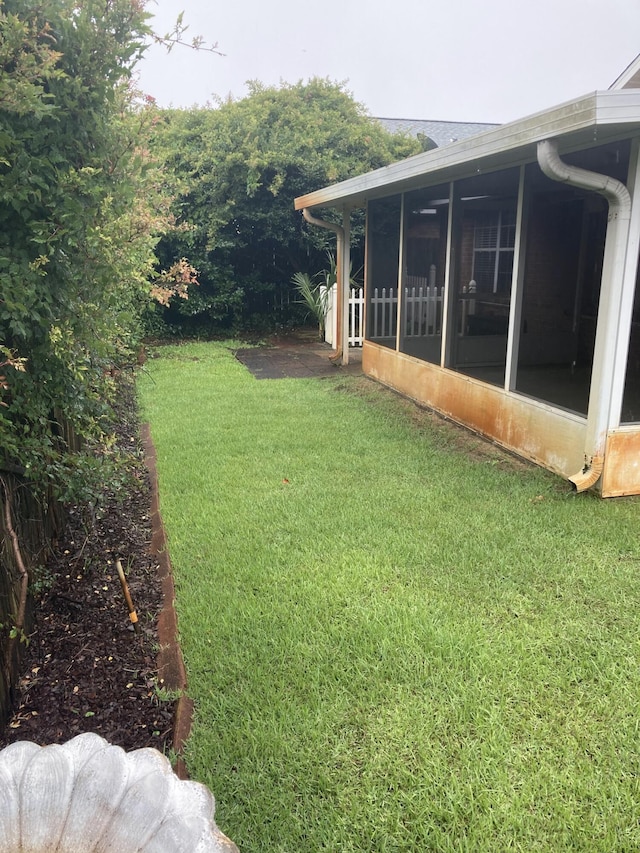 4627 Windstarr Dr, Destin, FL 32541 - view of grassy yard featuring a sunroom