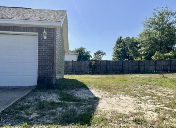 5151 Eagle Way, Crestview, FL 32539 - view of yard with a garage