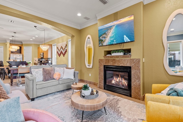 37 Conch Cay, Destin, FL 32541 - living area featuring recessed lighting, ornamental molding, a premium fireplace, and a chandelier