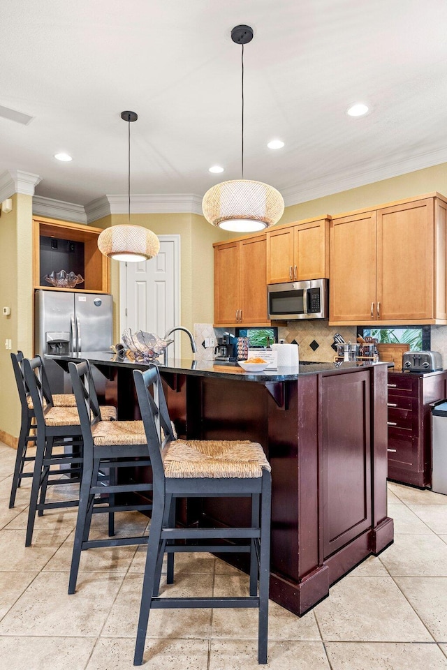 37 Conch Cay, Destin, FL 32541 - kitchen featuring appliances with stainless steel finishes, ornamental molding, dark countertops, decorative backsplash, and recessed lighting