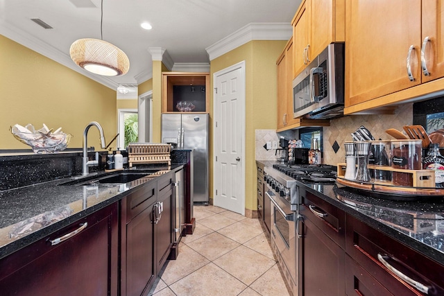 37 Conch Cay, Destin, FL 32541 - kitchen with appliances with stainless steel finishes, ornamental molding, tasteful backsplash, dark stone counters, and light tile patterned floors