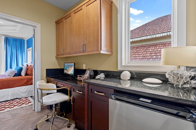 37 Conch Cay, Destin, FL 32541 - kitchen with dishwashing machine, dark stone counters, open floor plan, and tile patterned floors