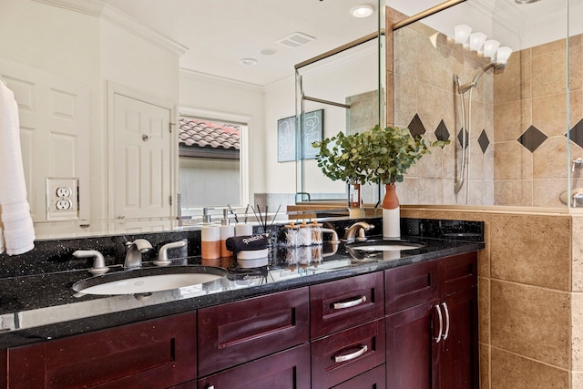 37 Conch Cay, Destin, FL 32541 - bathroom featuring double vanity, ornamental molding, and tiled shower
