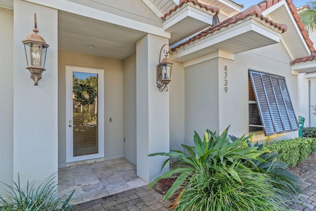 4739 Amhurst Cir, Destin, FL 32541 - entrance to property with stucco siding and a tile roof