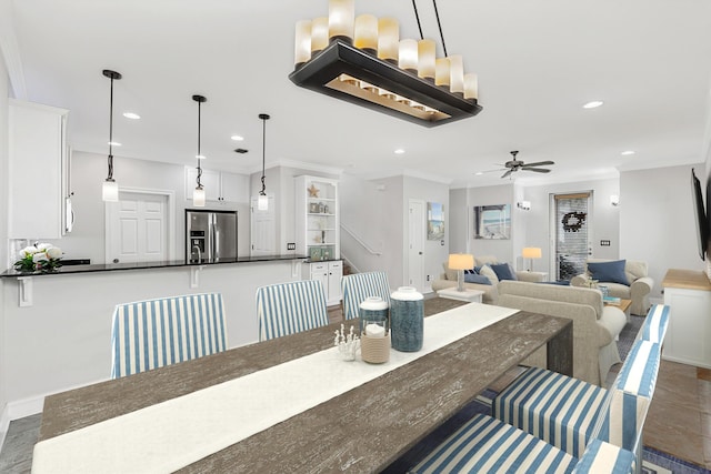 4739 Amhurst Cir, Destin, FL 32541 - dining room featuring recessed lighting, a ceiling fan, and ornamental molding
