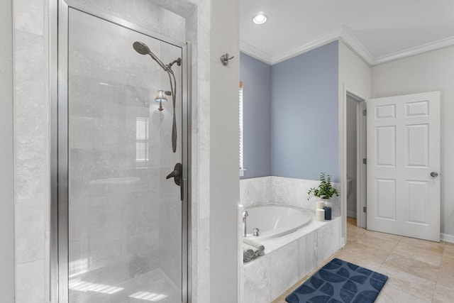 4739 Amhurst Cir, Destin, FL 32541 - bathroom featuring crown molding, a stall shower, a garden tub, and tile patterned flooring