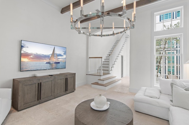 37 Sugar Loaf Aly, Alys Beach, FL 32461 - living room with a chandelier, stairs, beam ceiling, and a towering ceiling