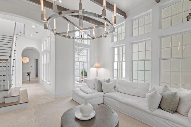 37 Sugar Loaf Aly, Alys Beach, FL 32461 - living room featuring arched walkways, a high ceiling, a chandelier, beam ceiling, and recessed lighting
