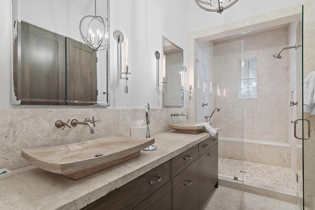 37 Sugar Loaf Aly, Alys Beach, FL 32461 - full bathroom with a chandelier, a shower stall, and double vanity