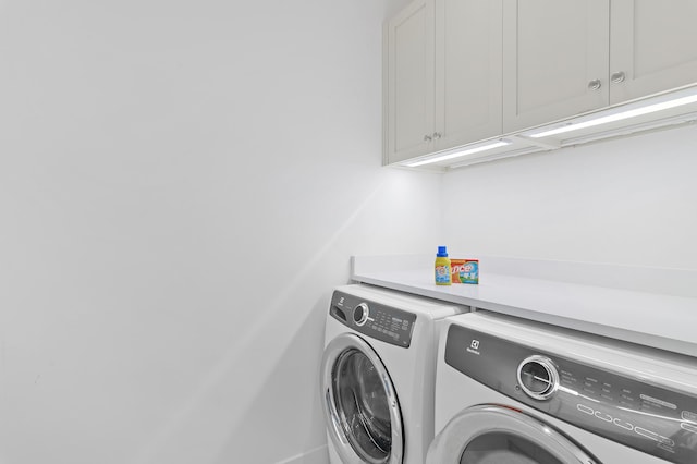 37 Sugar Loaf Aly, Alys Beach, FL 32461 - laundry area with separate washer and dryer and cabinet space