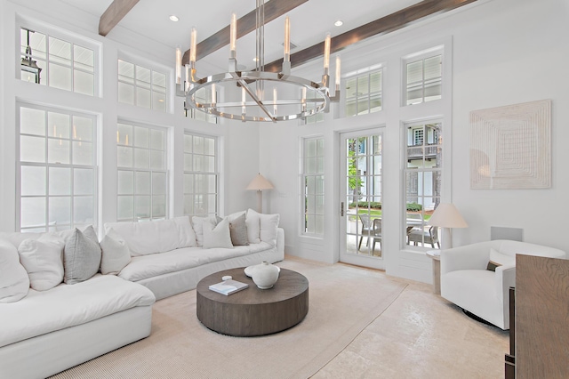 37 Sugar Loaf Aly, Alys Beach, FL 32461 - living area with a chandelier, beam ceiling, and a towering ceiling