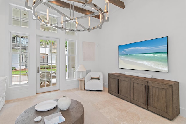 37 Sugar Loaf Aly, Alys Beach, FL 32461 - living area with plenty of natural light, a chandelier, and beamed ceiling