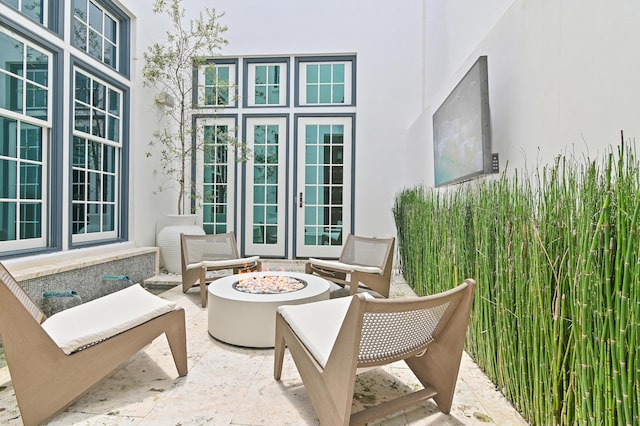 37 Sugar Loaf Aly, Alys Beach, FL 32461 - view of patio featuring french doors and a fire pit