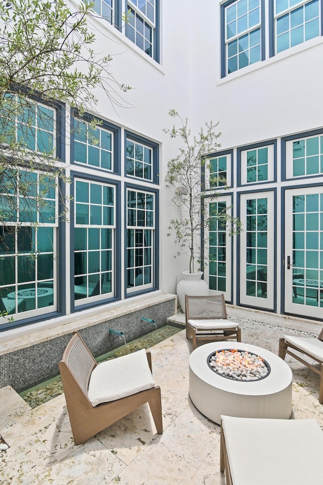 37 Sugar Loaf Aly, Alys Beach, FL 32461 - view of patio / terrace featuring a fire pit and french doors