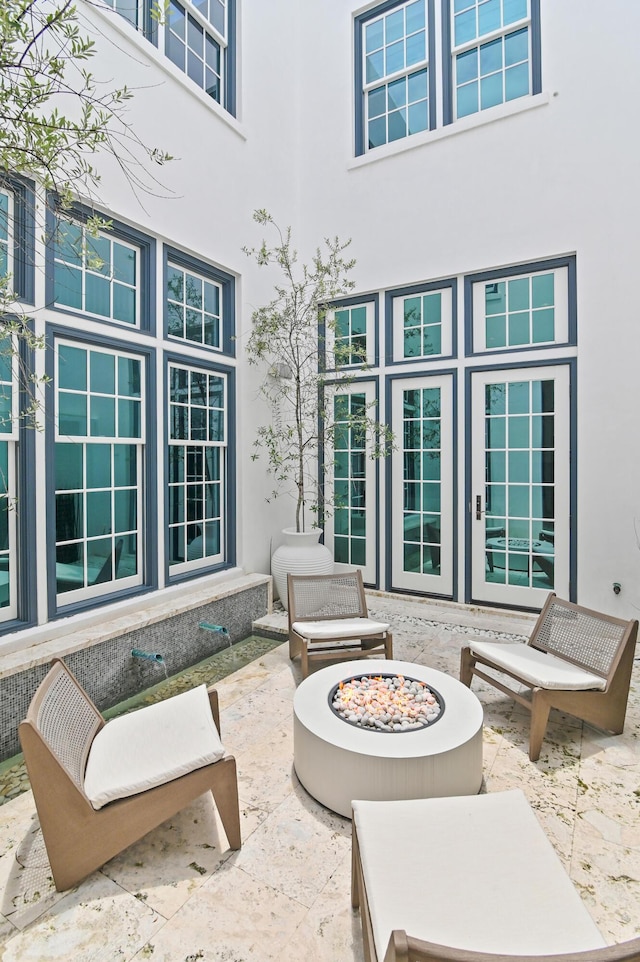 37 Sugar Loaf Aly, Alys Beach, FL 32461 - view of patio featuring french doors and an outdoor fire pit
