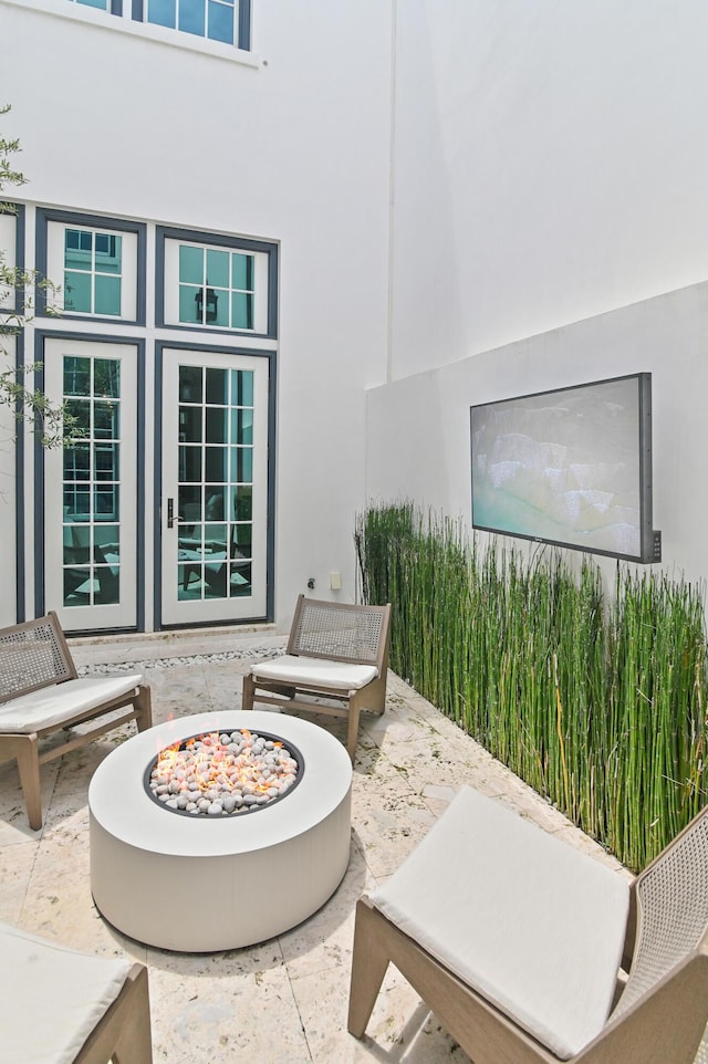37 Sugar Loaf Aly, Alys Beach, FL 32461 - view of patio with an outdoor fire pit and french doors