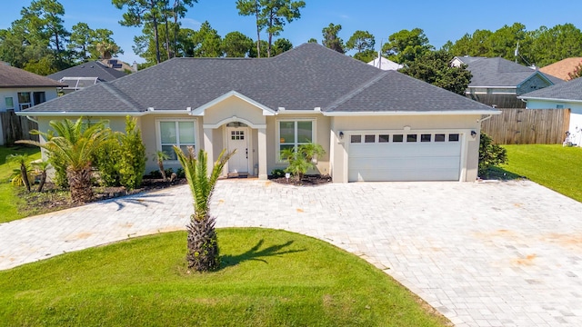 1009 Forest Shore Dr, Miramar Beach, FL 32550 - ranch-style home with a garage, stucco siding, decorative driveway, and a shingled roof