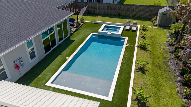 1009 Forest Shore Dr, Miramar Beach, FL 32550 - view of swimming pool with a storage shed, a fenced backyard, and a pool with connected hot tub