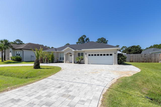 1009 Forest Shore Dr, Miramar Beach, FL 32550 - ranch-style home featuring decorative driveway, an attached garage, and stucco siding