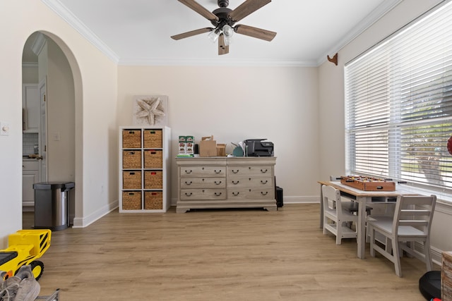 1009 Forest Shore Dr, Miramar Beach, FL 32550 - sitting room featuring arched walkways, ornamental molding, ceiling fan, and light wood-style floors