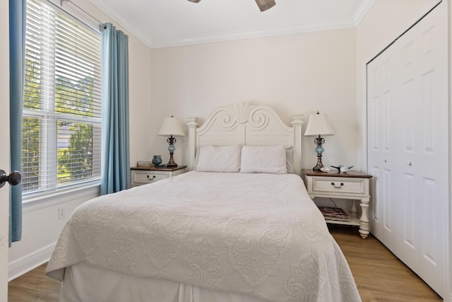 1009 Forest Shore Dr, Miramar Beach, FL 32550 - bedroom with crown molding, light wood-type flooring, and a ceiling fan