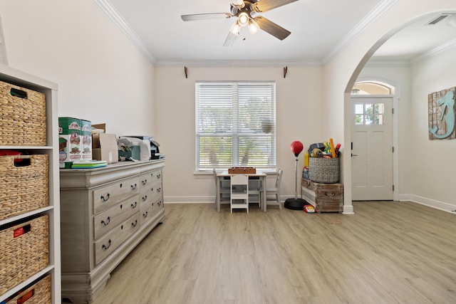1009 Forest Shore Dr, Miramar Beach, FL 32550 - entrance foyer with wood finished floors, crown molding, arched walkways, and a ceiling fan