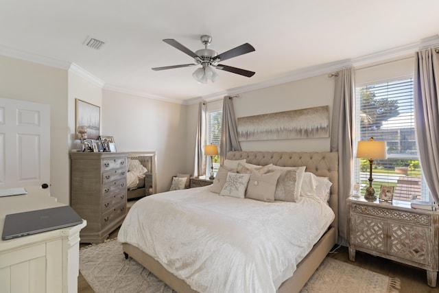 1009 Forest Shore Dr, Miramar Beach, FL 32550 - bedroom with ornamental molding, wood finished floors, multiple windows, and ceiling fan