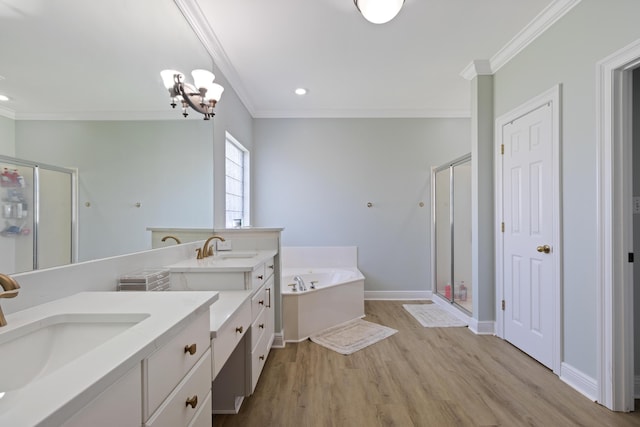 1009 Forest Shore Dr, Miramar Beach, FL 32550 - full bath with crown molding, a shower stall, a bath, two vanities, and wood finished floors