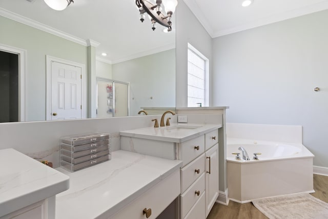1009 Forest Shore Dr, Miramar Beach, FL 32550 - full bathroom with wood finished floors, ornamental molding, vanity, a garden tub, and a stall shower