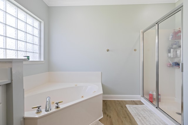 1009 Forest Shore Dr, Miramar Beach, FL 32550 - full bath featuring a stall shower, a bath, and wood finished floors