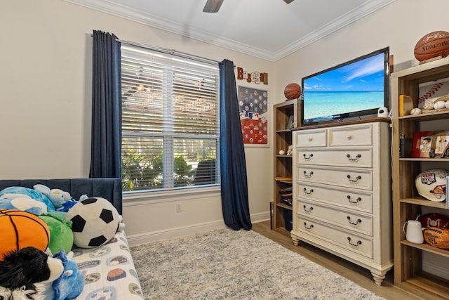 1009 Forest Shore Dr, Miramar Beach, FL 32550 - bedroom featuring ornamental molding, wood finished floors, and a ceiling fan