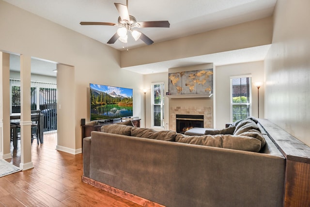 2808 Ping Ln, Crestview, FL 32539 - living room featuring wood-type flooring, a tile fireplace, and a ceiling fan