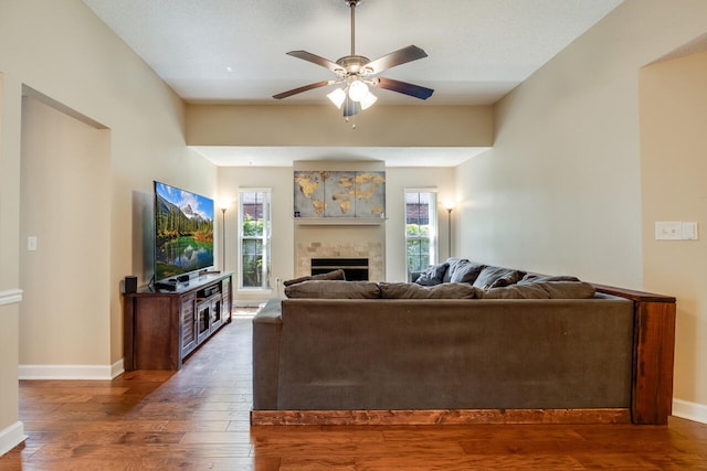 2808 Ping Ln, Crestview, FL 32539 - living room with wood-type flooring, a ceiling fan, and a fireplace