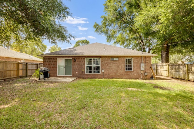 2808 Ping Ln, Crestview, FL 32539 - rear view of property featuring a patio, a fenced backyard, and brick siding