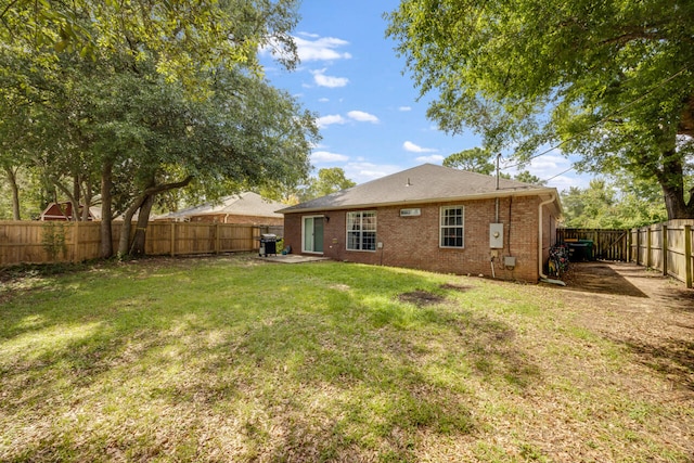 2808 Ping Ln, Crestview, FL 32539 - rear view of house featuring a fenced backyard and brick siding