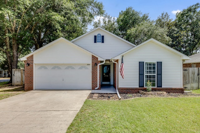 2808 Ping Ln, Crestview, FL 32539 - traditional-style house featuring an attached garage, driveway, and brick siding