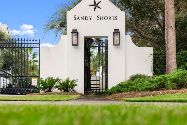 65 Sandy Shores Ct, Inlet Beach, FL 32461 - view of exterior entry featuring a gate