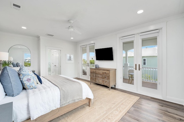 65 Sandy Shores Ct, Inlet Beach, FL 32461 - bedroom featuring french doors, access to exterior, multiple windows, ornamental molding, and light wood-style flooring
