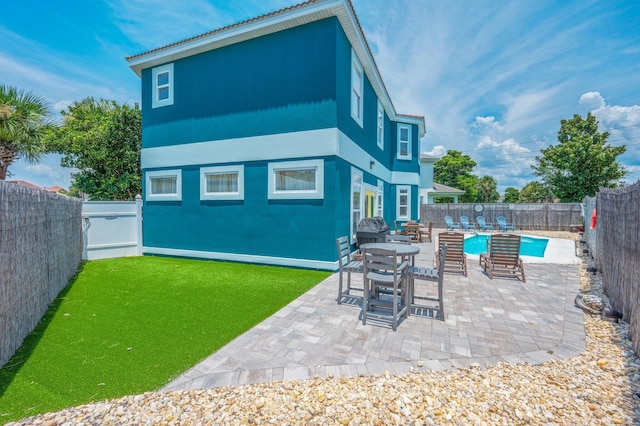 102 Terra Cotta Way, Destin, FL 32541 - rear view of property featuring a fenced backyard, a patio, and stucco siding