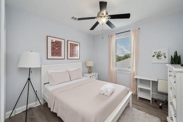 102 Terra Cotta Way, Destin, FL 32541 - bedroom with dark wood-style flooring, a desk, and a ceiling fan