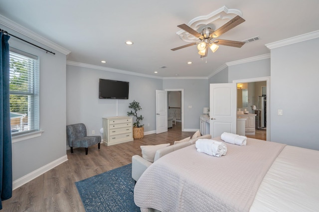 102 Terra Cotta Way, Destin, FL 32541 - bedroom with wood finished floors, ornamental molding, and recessed lighting