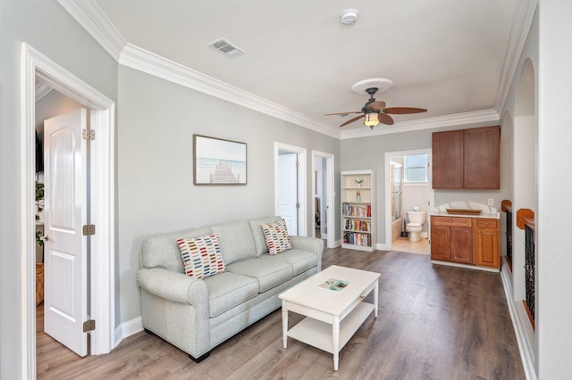 102 Terra Cotta Way, Destin, FL 32541 - living area with ornamental molding, wood finished floors, and ceiling fan