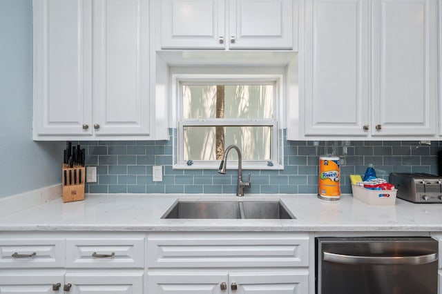 102 Terra Cotta Way, Destin, FL 32541 - kitchen with stainless steel dishwasher, white cabinets, and tasteful backsplash